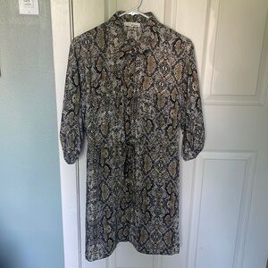June and Hudson. Knee length, 3/4 sleeves snake skin print dress.